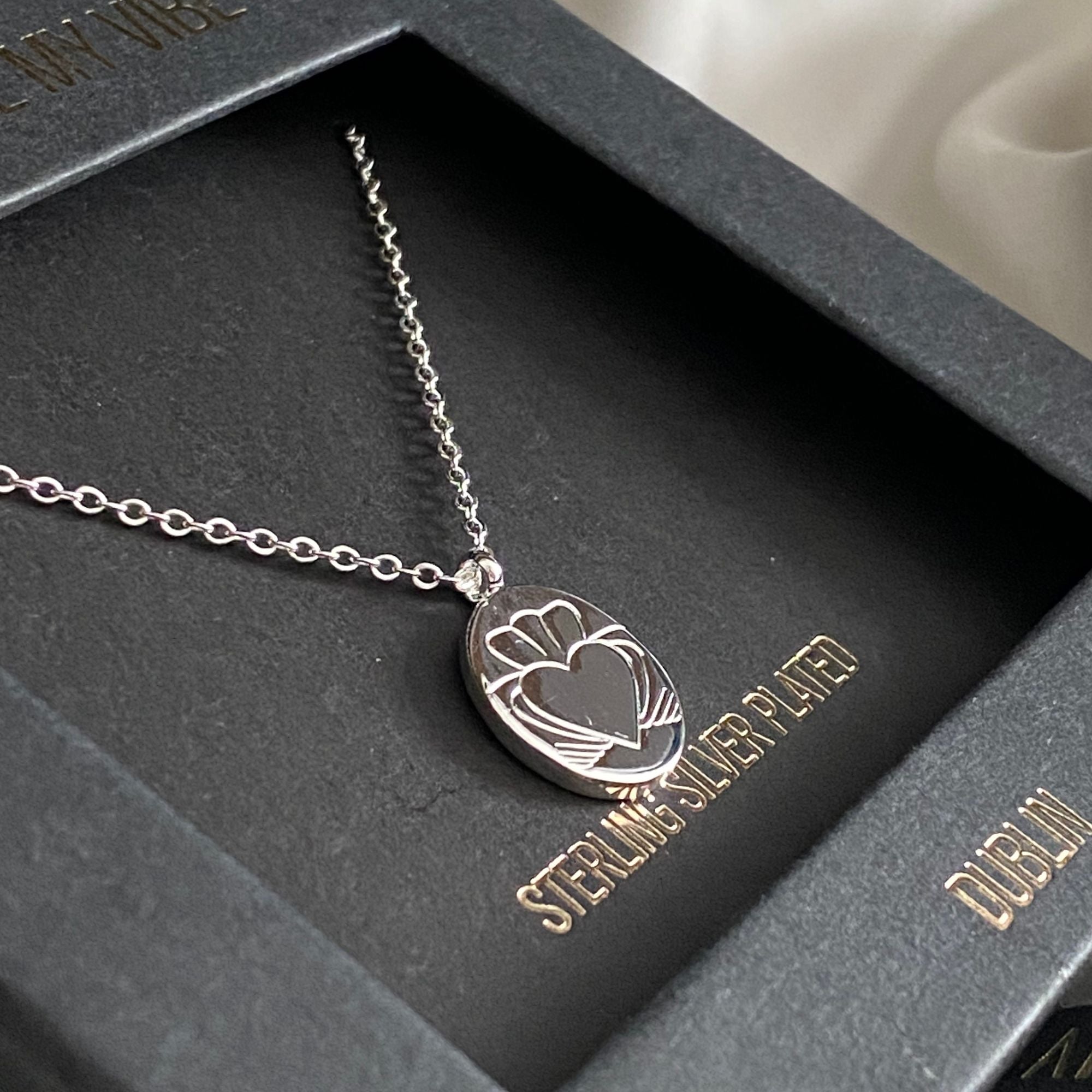 Silver Heart Strong Coin Claddagh Necklace in a Gift Box