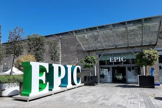 Brick building entrance with EPIC sign, green and white letters on a banner, and metal awning above