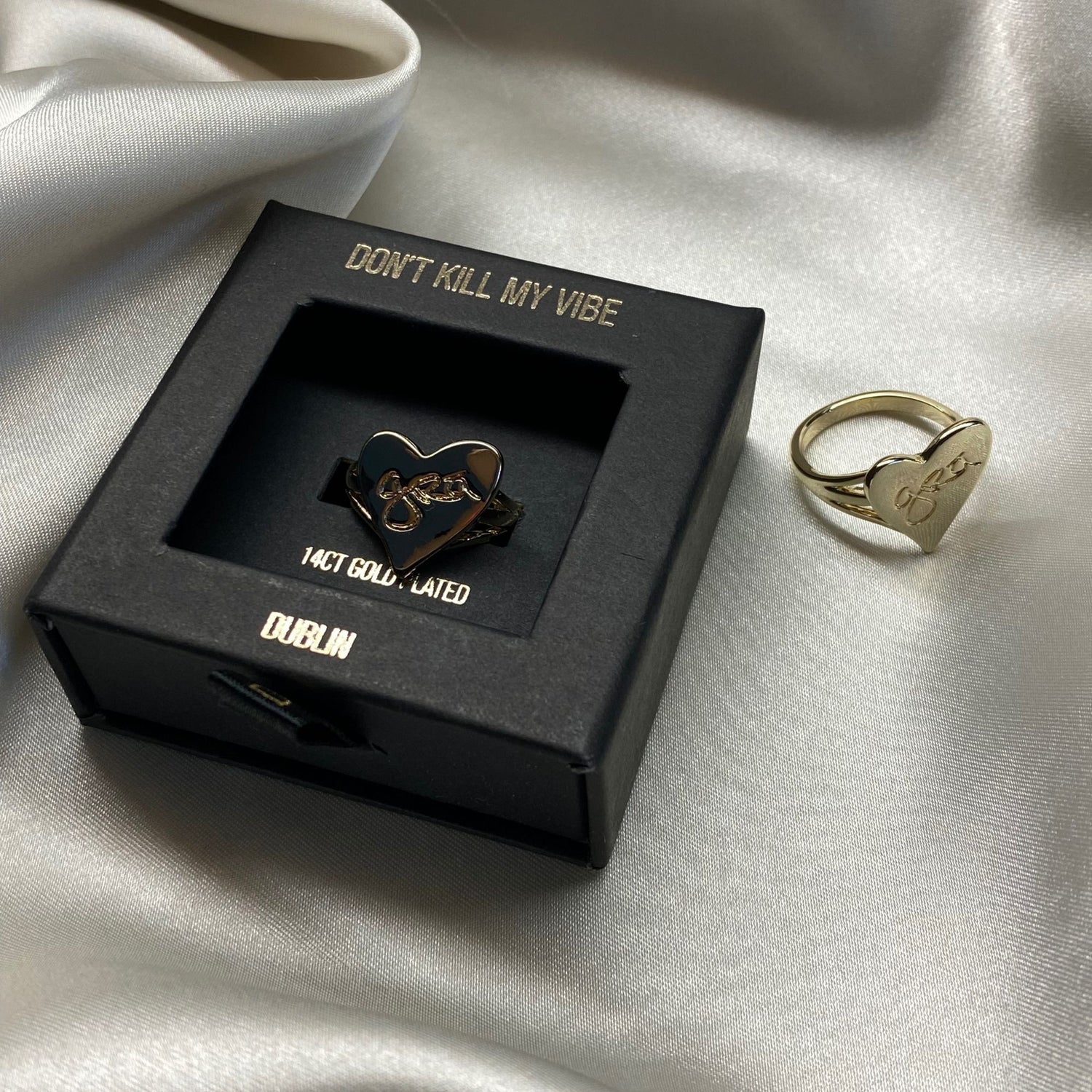 2 Gold Grá Mór Rings on display with one in a Gift Box